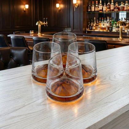Designer whiskey tumblers with artistic amber base accents for luxury drinkware collections and modern entertaining setups