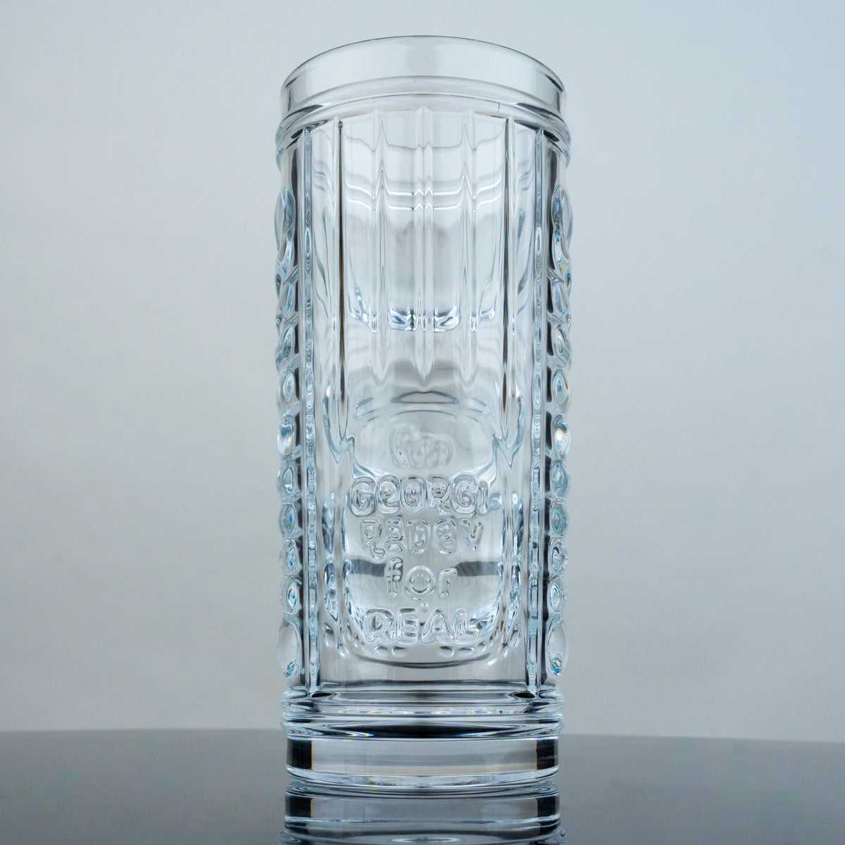 Tiki glass front, embossed Padev signature