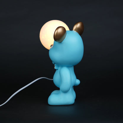 blue bear lamp holding glowing moon bulb with gold accents
