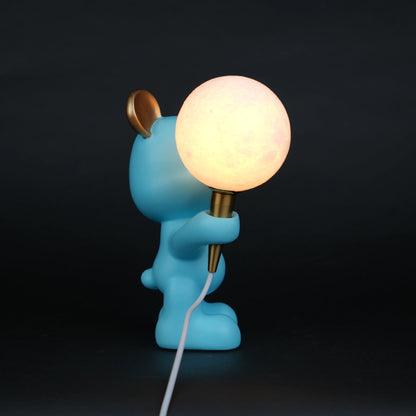 blue bear lamp holding glowing moon bulb with gold accents