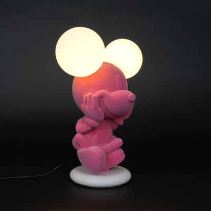 Pink figurine lamp with two warm glowing orb lights on top.