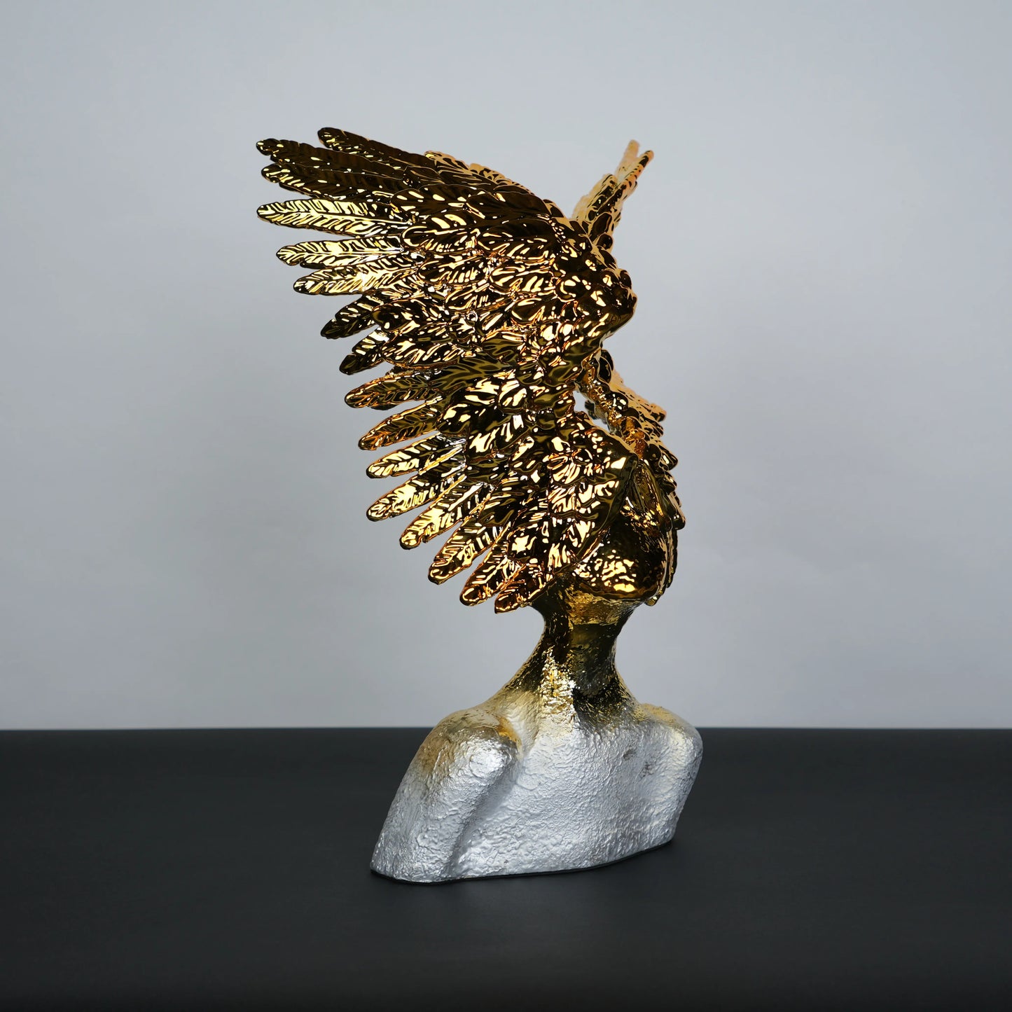 Electroplated gold phoenix wing sculpture with textured silver base – luxury modern décor.