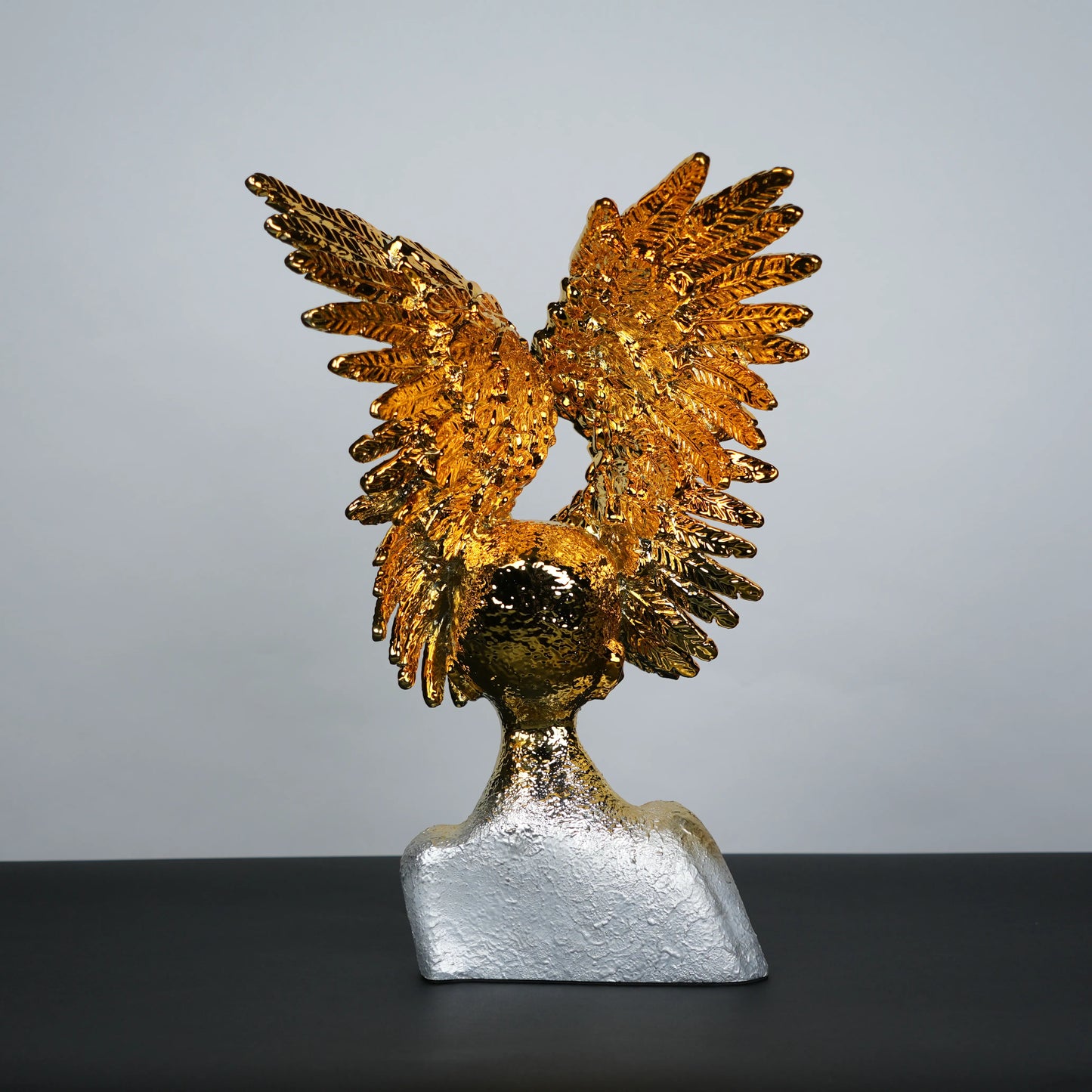Electroplated gold phoenix wing sculpture with textured silver base – luxury modern décor.