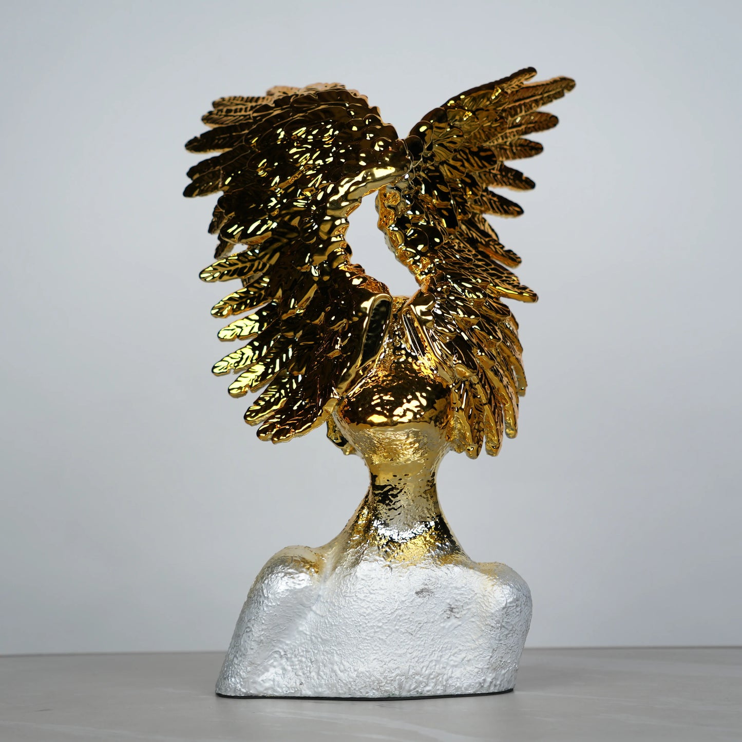 Electroplated gold phoenix wing sculpture with textured silver base – luxury modern décor.