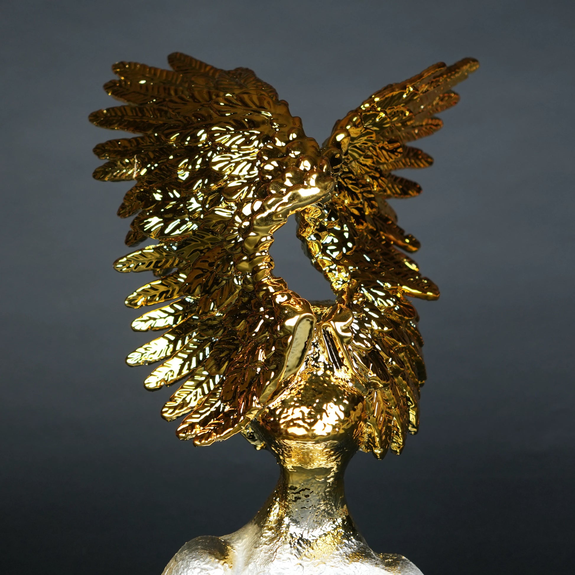 Electroplated gold phoenix wing sculpture with textured silver base – luxury modern décor.