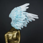 Luxury feather head figurine with detailed layered wing design and metallic finish for elegant tabletop decor arrangements