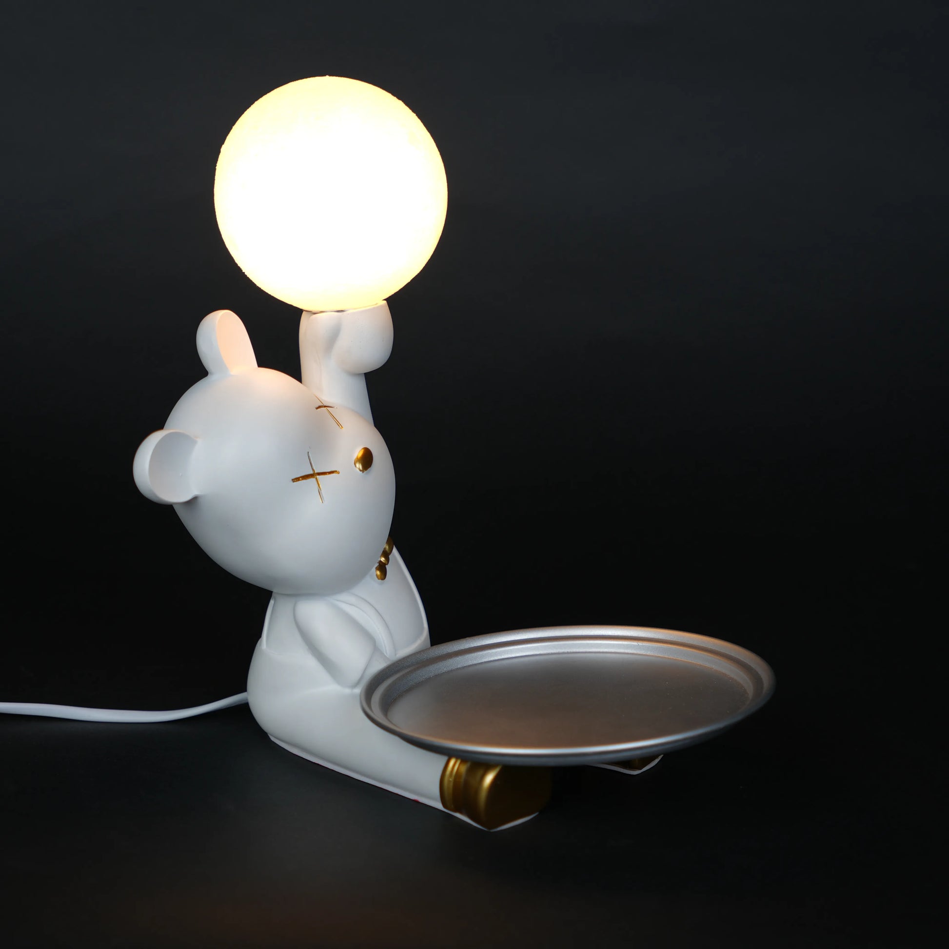 White bunny lamp with glowing orb ears holding a metallic tray.