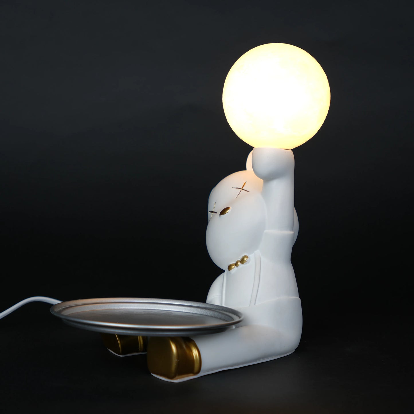 White bunny lamp with glowing orb ears holding a metallic tray.
