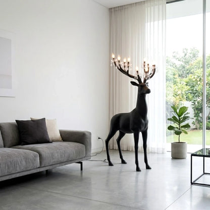 Black reindeer glow lamp w/ grey sofa scene