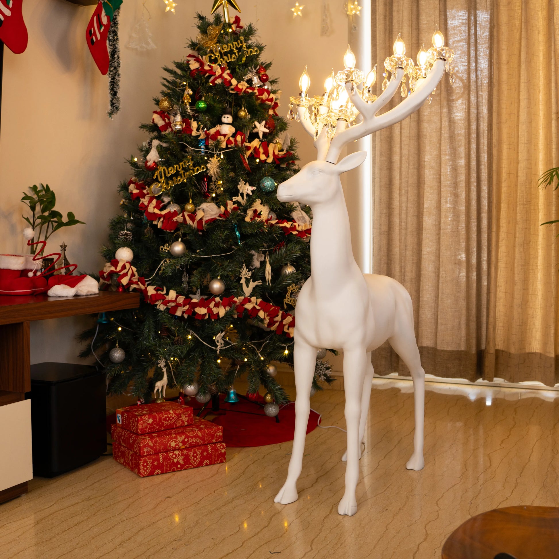 White reindeer sculpture lamp with glowing antlers