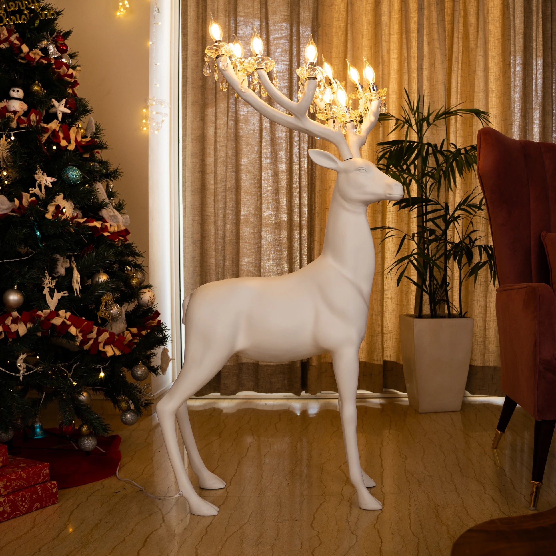 White reindeer sculpture lamp with glowing antlers