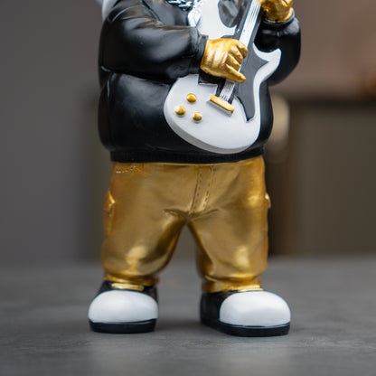 Small astronaut figurine playing guitar with gold helmet and metallic finish — Cosmic Rockstar Figurine by Ghar Art, handcrafted modern tabletop decor collectible.