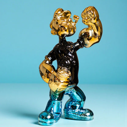 Aqua and gold metallic resin figurine in a dynamic pose — luxury high-gloss decorative sculpture by Ghar Art.