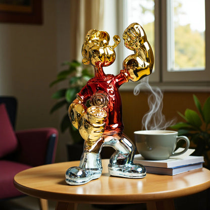 Red, gold, and silver metallic resin figurine in a dynamic pose — luxury electroplated decorative sculpture by Ghar Art.