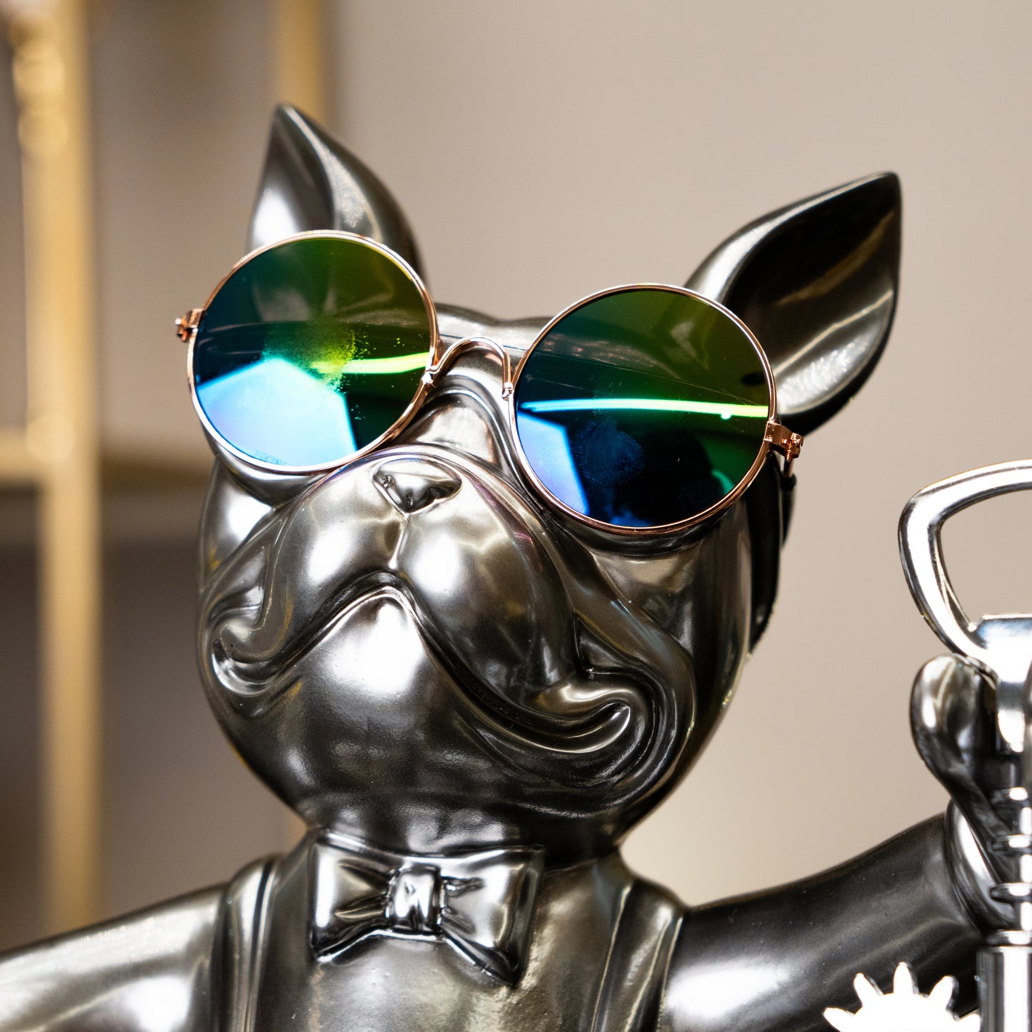 Metallic bulldog figurine holding corkscrew and wearing sunglasses — Boozy Bulldog wine holder by Ghar Art, luxury tabletop bar décor collectible.