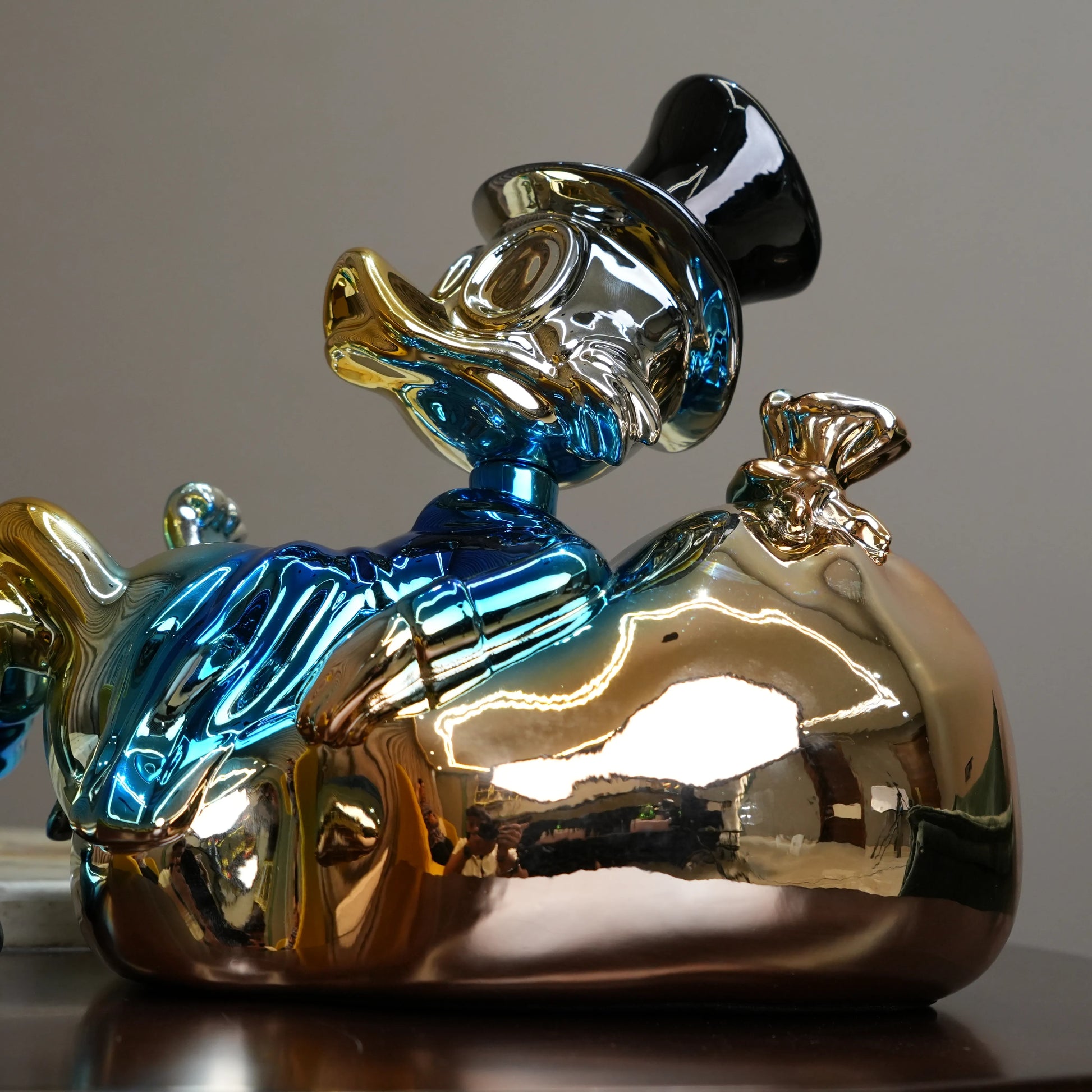 Chrome Money Tycoon blue sculpture