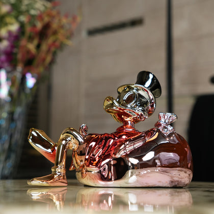 gold chrome pop art figurine with cartoon style decor for modern home styling