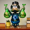Metallic green and blue duck sculpture holding gold money bags — Money Maestro Sculpture by Ghar Art, handcrafted luxury pop-art collectible for modern decor.