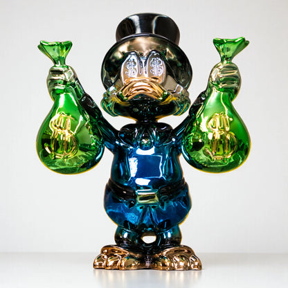 Metallic green and blue duck sculpture holding gold money bags — Money Maestro Sculpture by Ghar Art, handcrafted luxury pop-art collectible for modern decor.