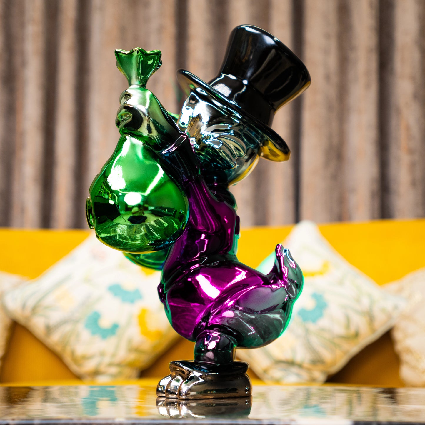 Pink metallic duck sculpture holding emerald money bags — Money Maestro – Pink Edition by Ghar Art, handcrafted luxury pop-art collectible.