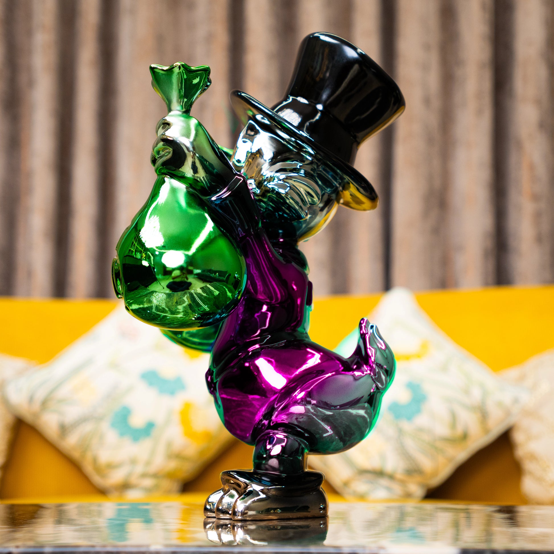 Pink metallic duck sculpture holding emerald money bags — Money Maestro – Pink Edition by Ghar Art, handcrafted luxury pop-art collectible.