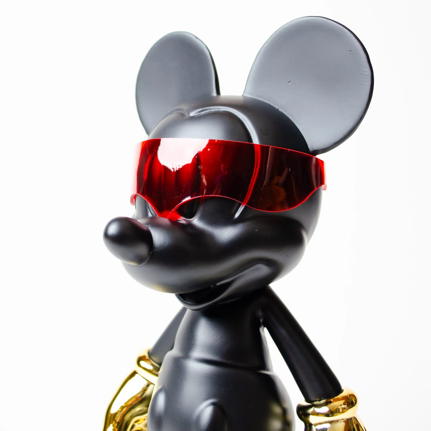 Cyberpunk mascot mini matte black sculpture with gold hands and red visor for modern home decor