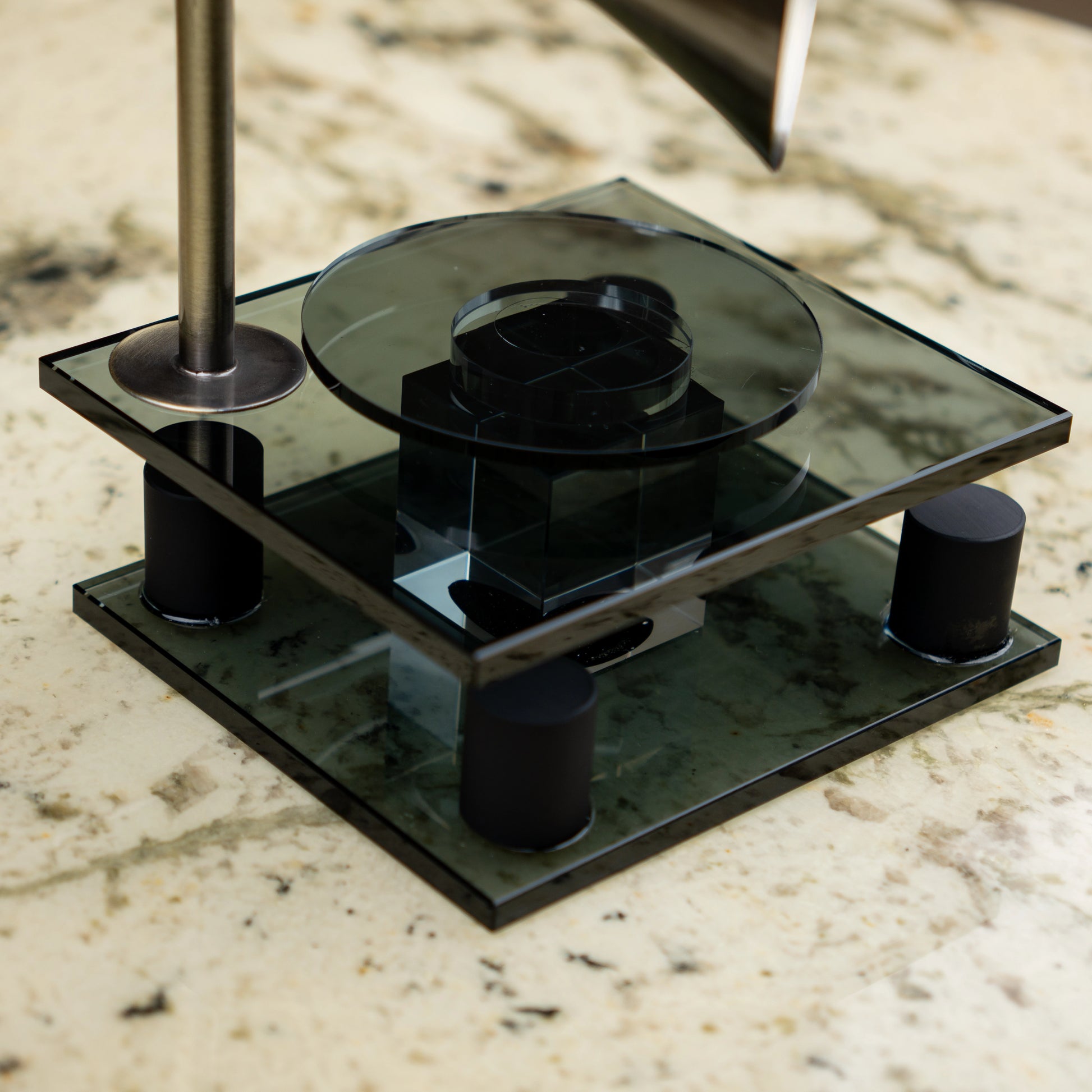 black retro-style acoustic amplifier decor piece with gold funnel top