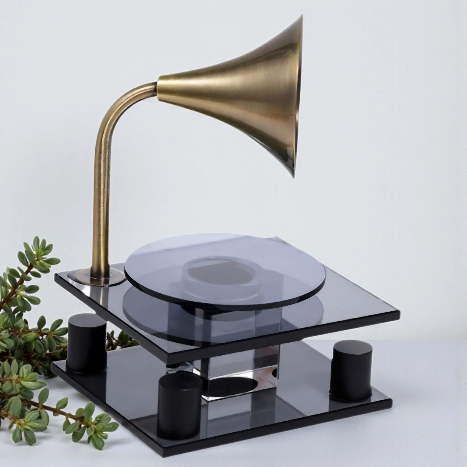 black retro-style acoustic amplifier decor piece with gold funnel top