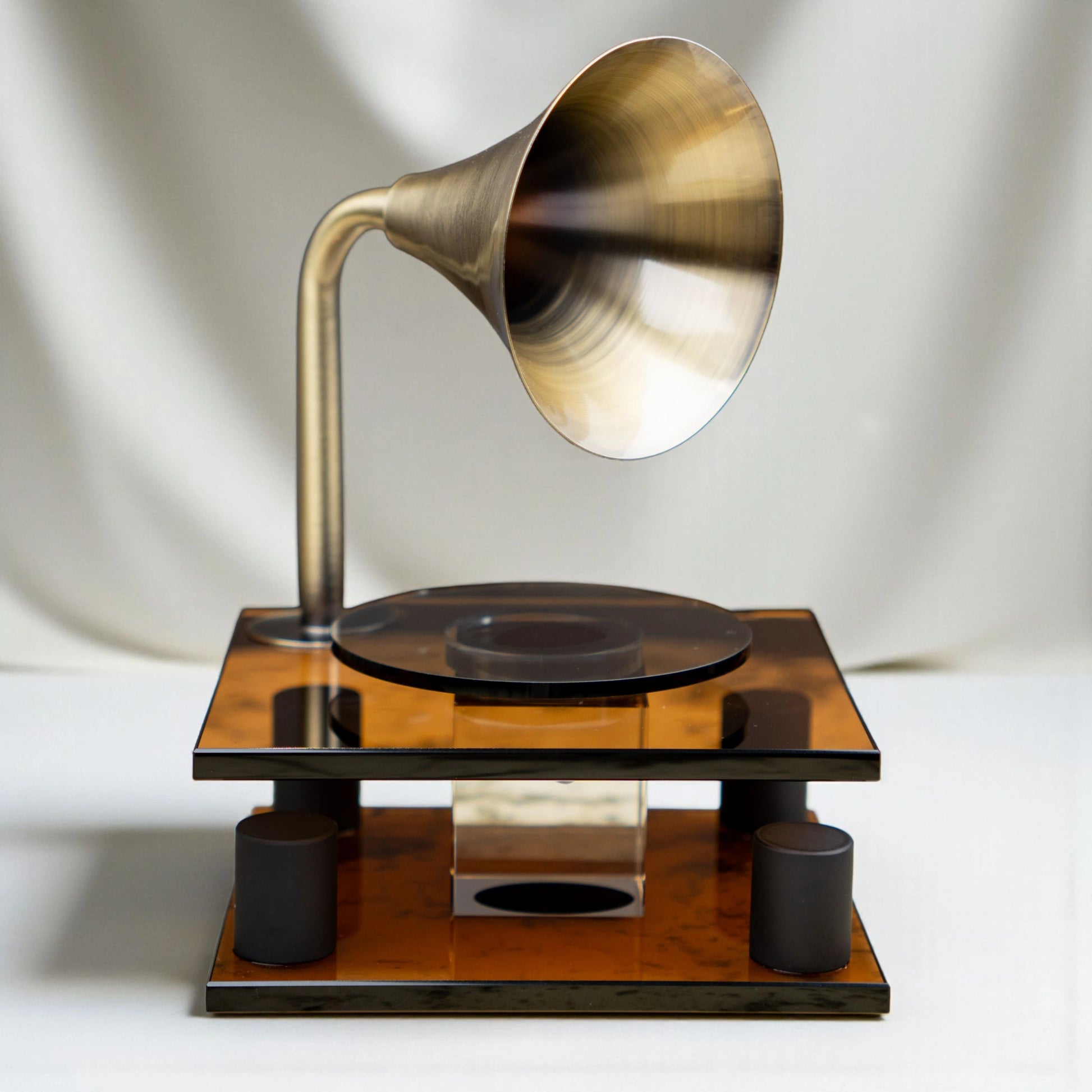 brown retro-style acoustic amplifier decor piece with gold funnel top