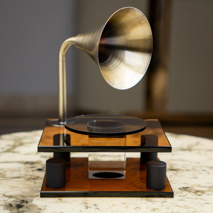 brown retro-style acoustic amplifier decor piece with gold funnel top