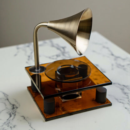 brown retro-style acoustic amplifier decor piece with gold funnel top
