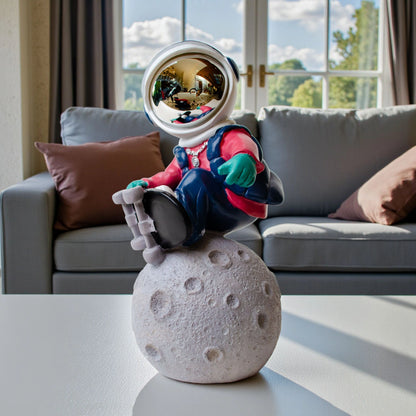 Astronaut skateboard figurine on moon base in multicolor resin