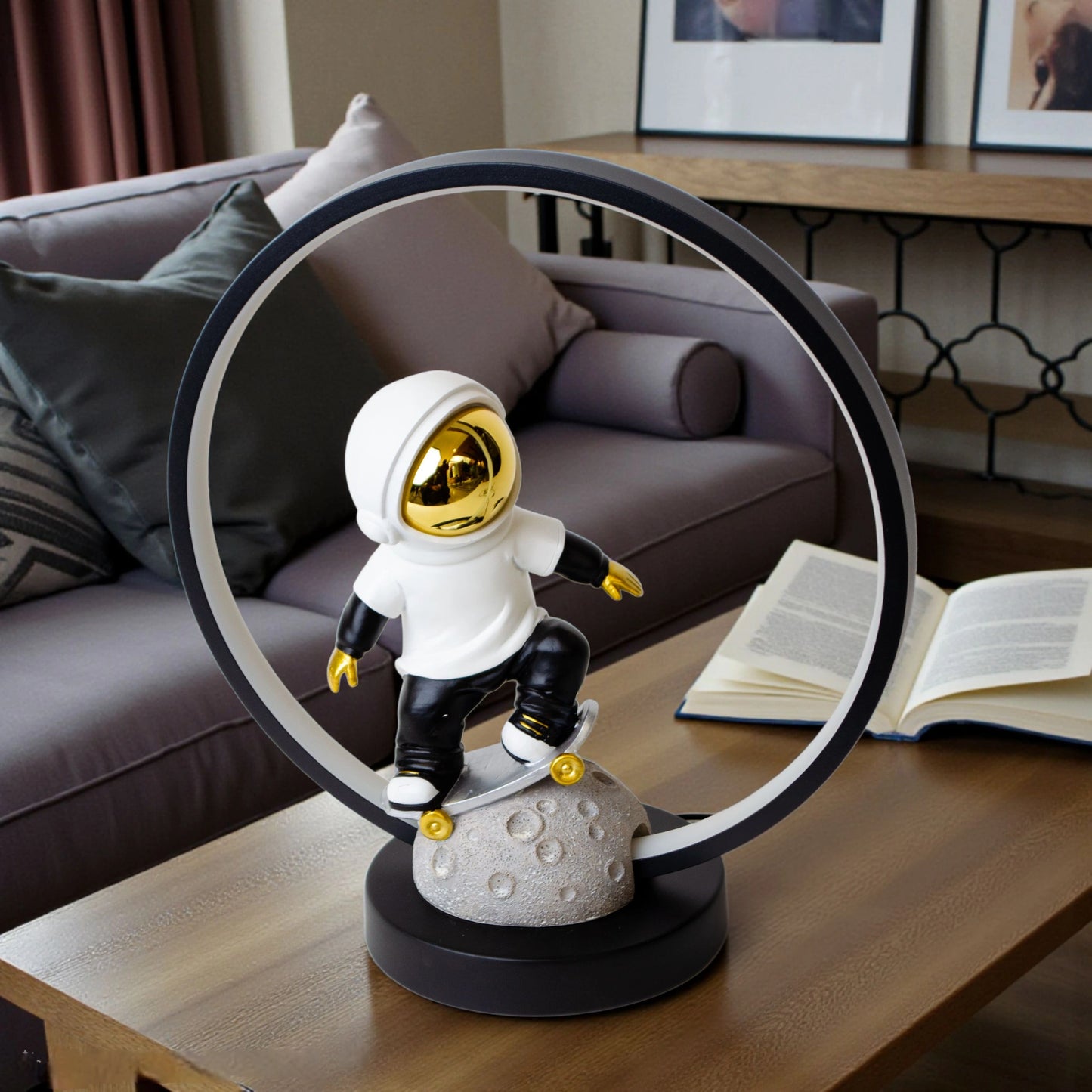 Astronaut skater lamp with white suit, gold visor and LED halo on grey moon base