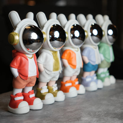 Astronaut figurine with orange jacket and chrome visor.