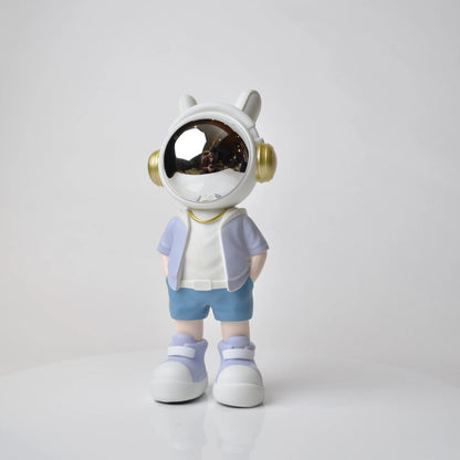 Astronaut figurine with chrome visor wearing blue shorts and lavender jacket.