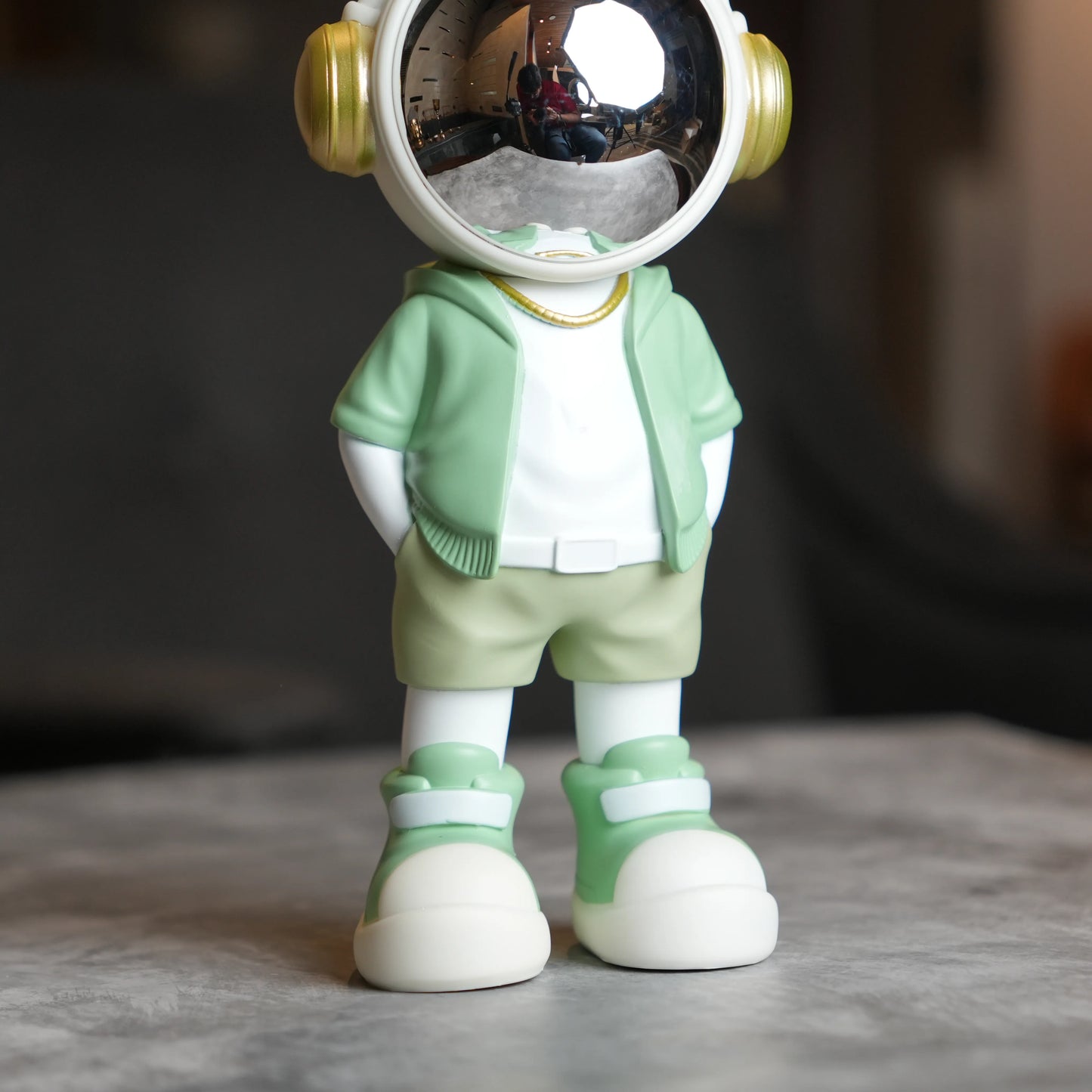 Cosmic Mint Voyager astronaut figurine with mint jacket and chrome visor.
