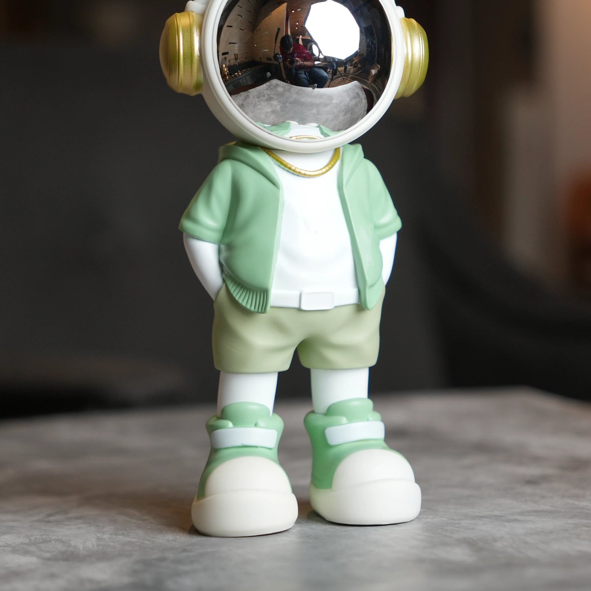 Cosmic Mint Voyager astronaut figurine with mint jacket and chrome visor.