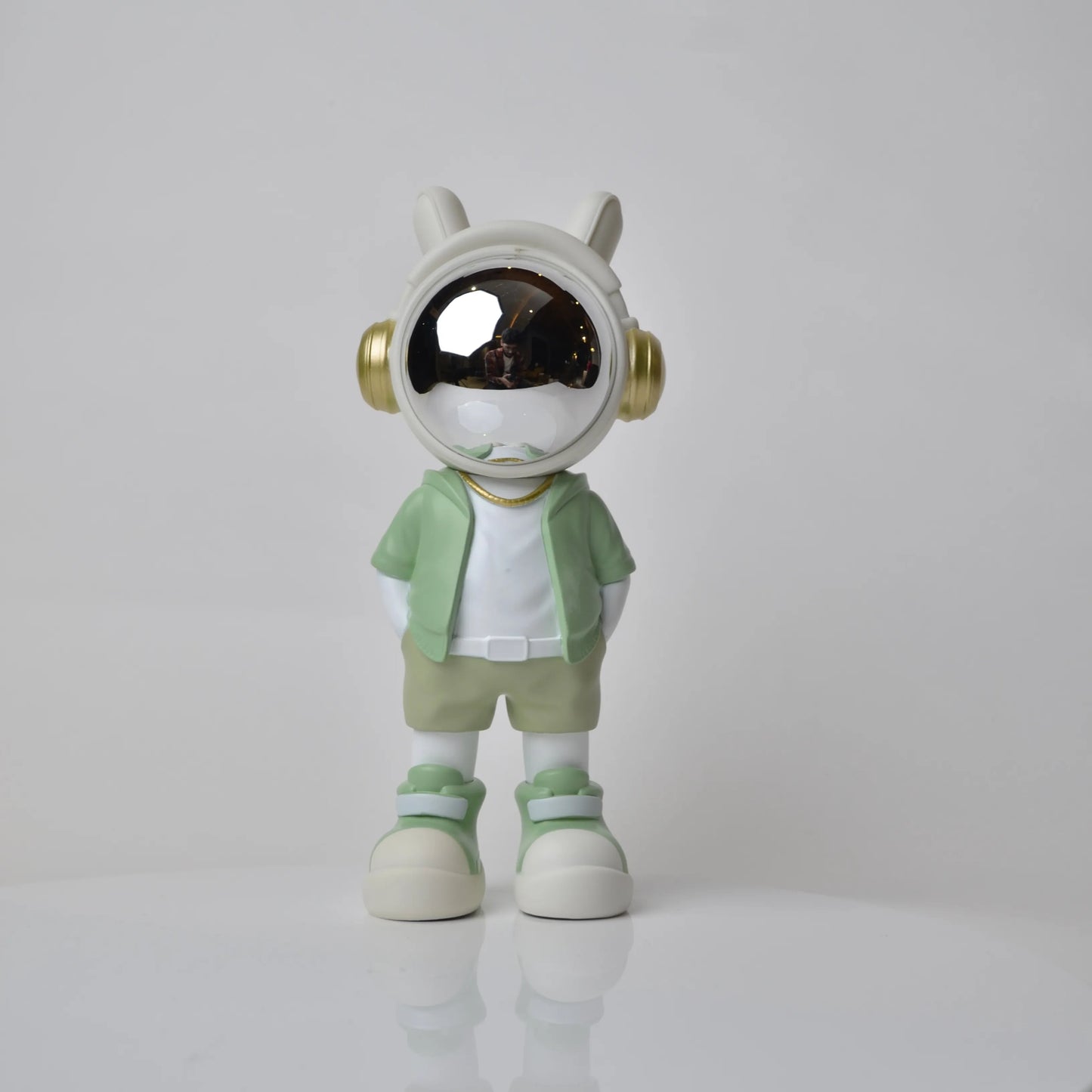 Cosmic Mint Voyager astronaut figurine with mint jacket and chrome visor.