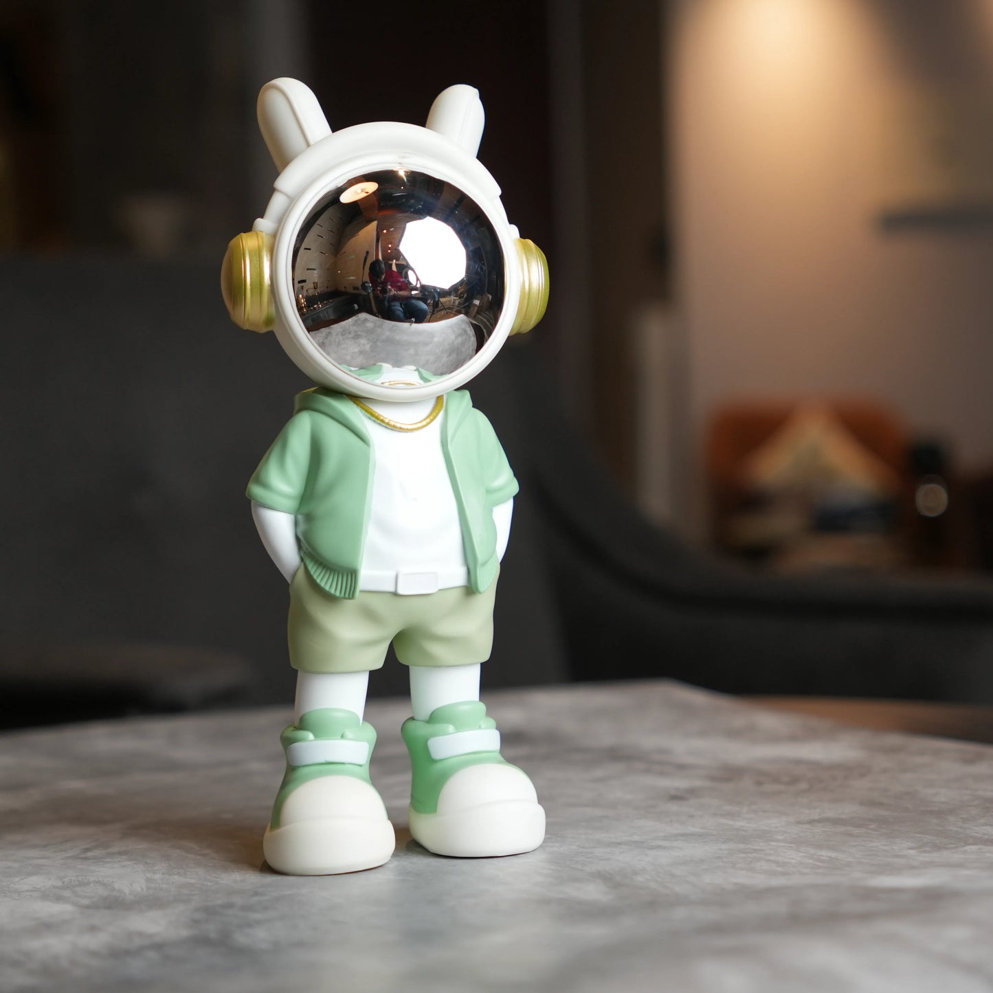 Cosmic Mint Voyager astronaut figurine with mint jacket and chrome visor.