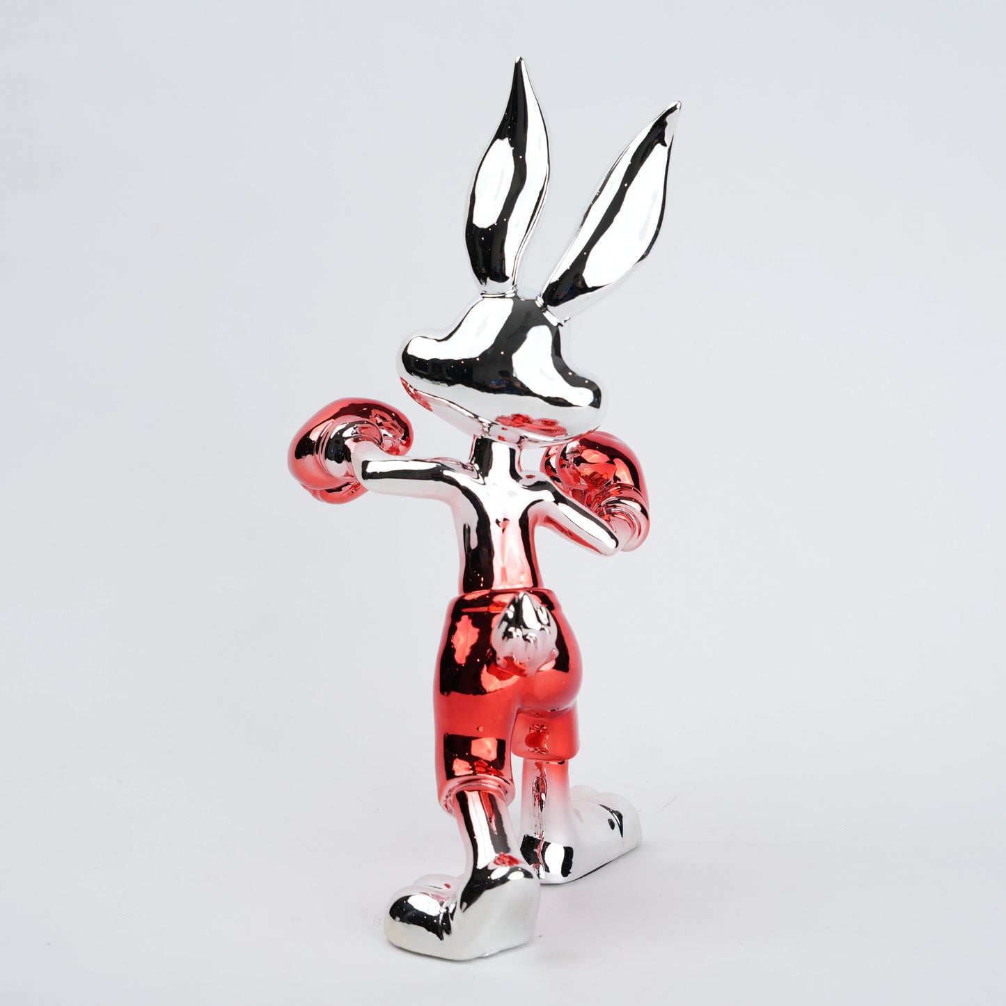 Resin bunny boxer figurine with chrome black finish and scarlet red gloves and shorts