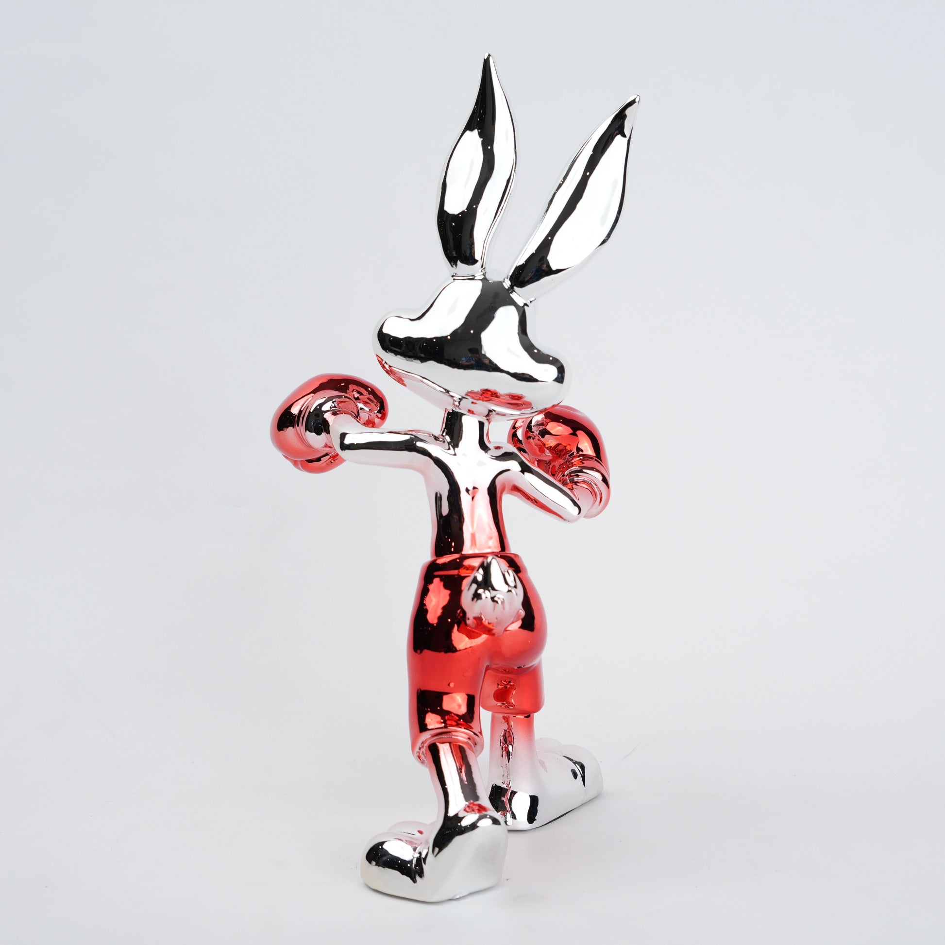 Resin bunny boxer figurine with chrome black finish and scarlet red gloves and shorts