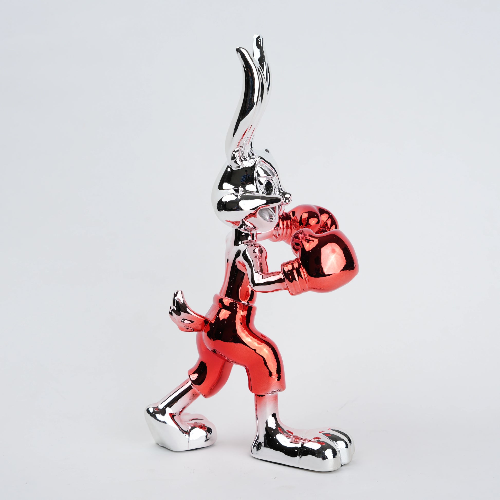 Resin bunny boxer figurine with chrome black finish and scarlet red gloves and shorts