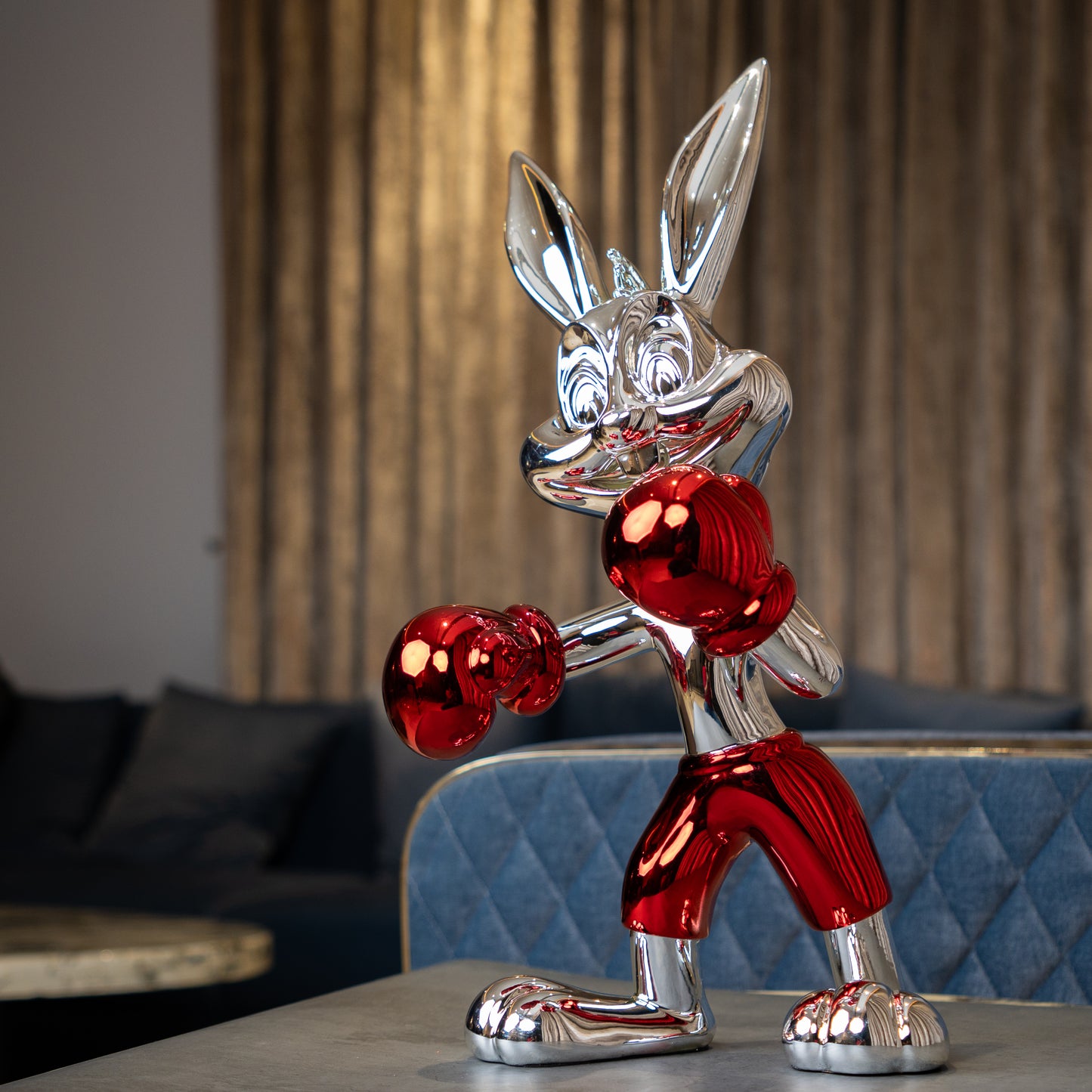 Resin bunny boxer figurine with chrome black finish and scarlet red gloves and shorts