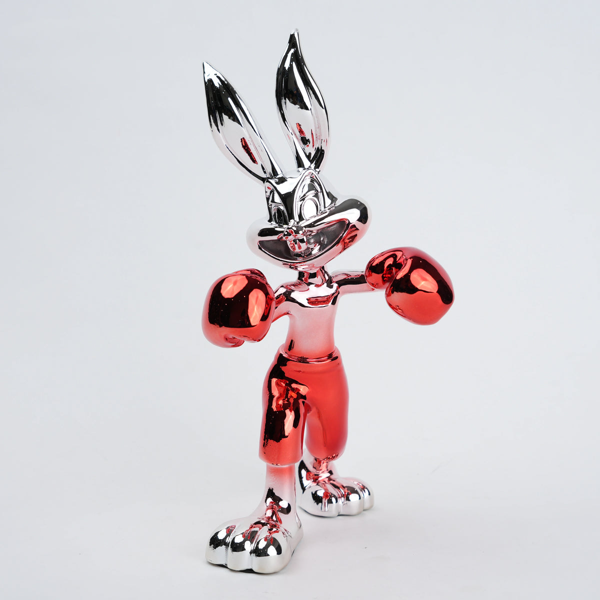 Resin bunny boxer figurine with chrome black finish and scarlet red gloves and shorts