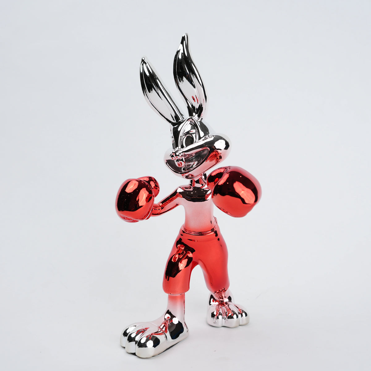 Resin bunny boxer figurine with chrome black finish and scarlet red gloves and shorts