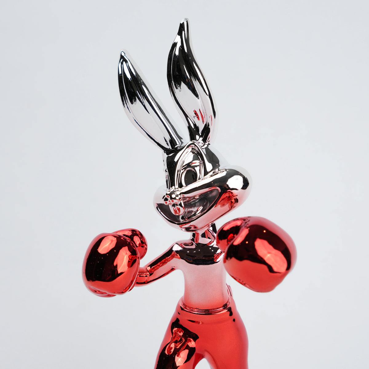 Resin bunny boxer figurine with chrome black finish and scarlet red gloves and shorts