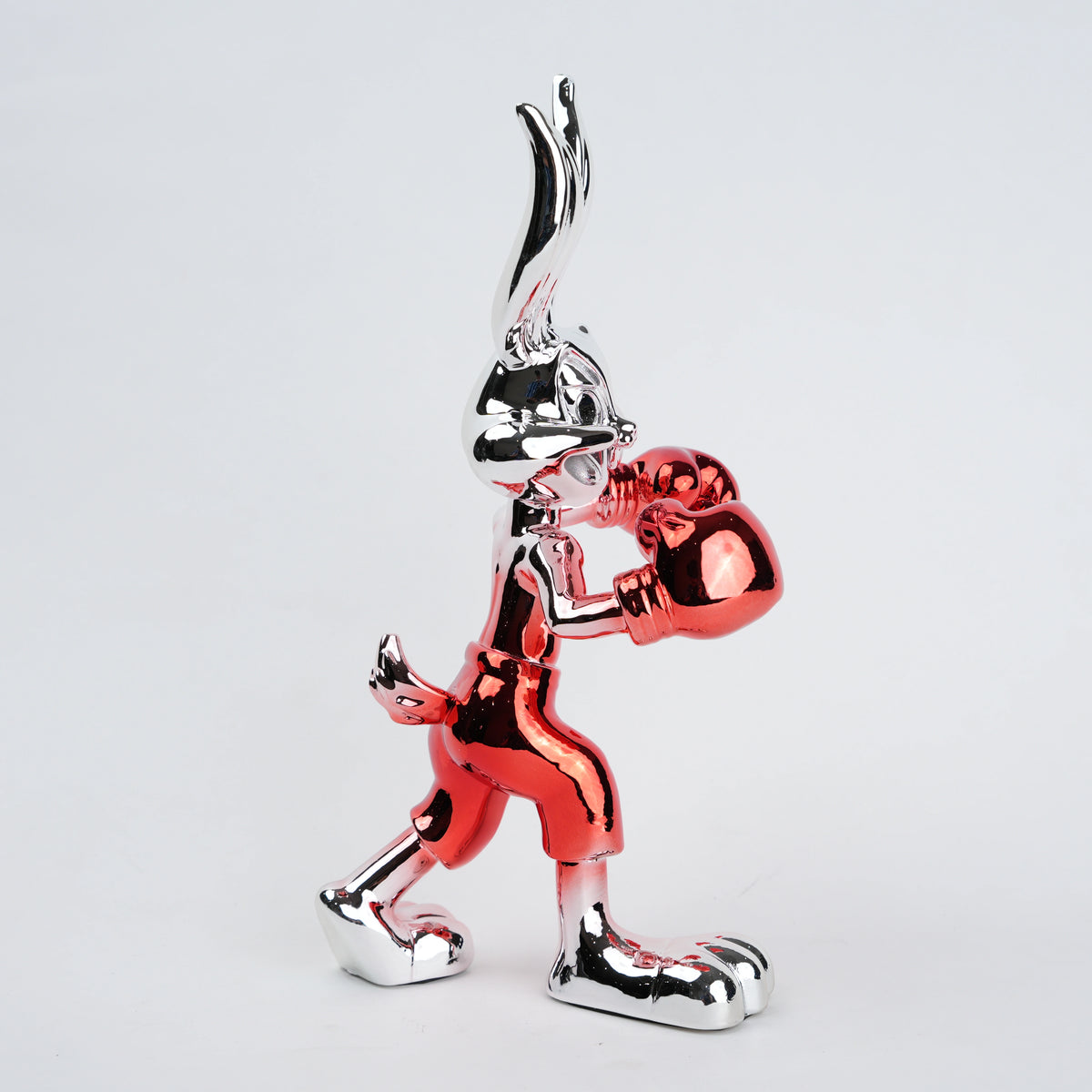 Resin bunny boxer figurine with chrome black finish and scarlet red gloves and shorts