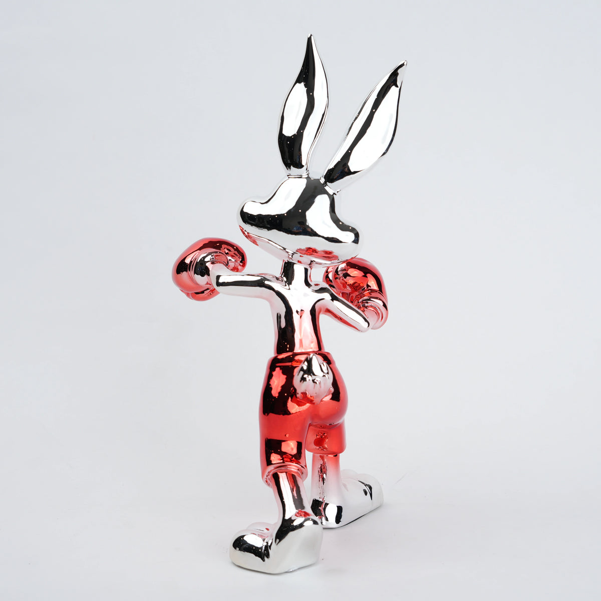 Resin bunny boxer figurine with chrome black finish and scarlet red gloves and shorts