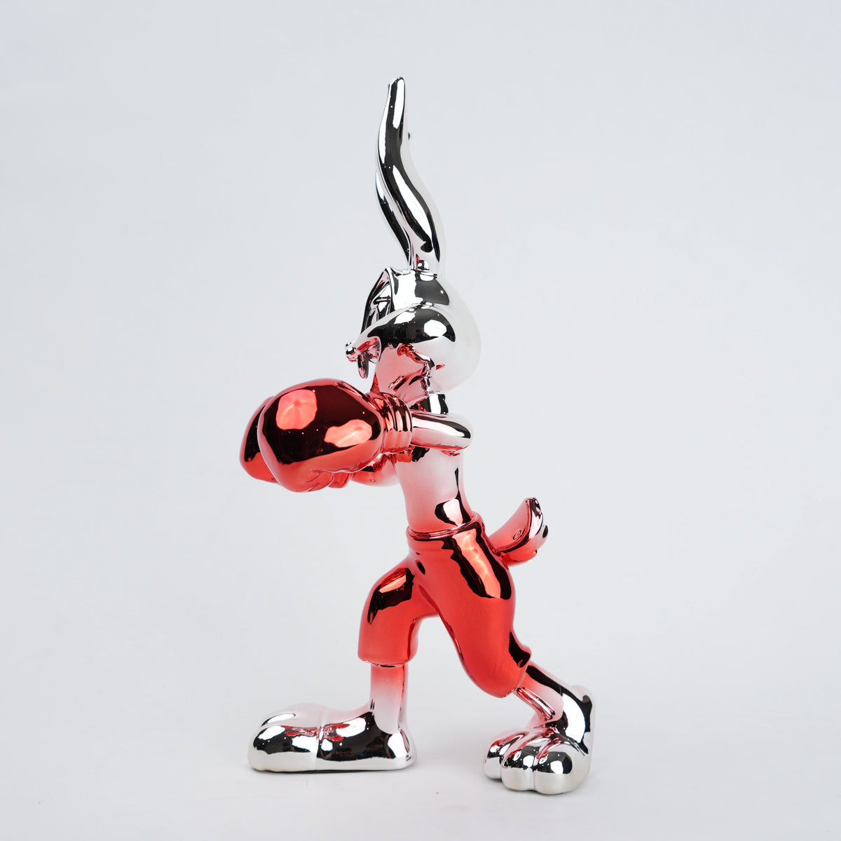 Resin bunny boxer figurine with chrome black finish and scarlet red gloves and shorts