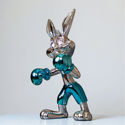 Resin bunny boxer figurine with chrome silver finish and aqua blue gloves and shorts